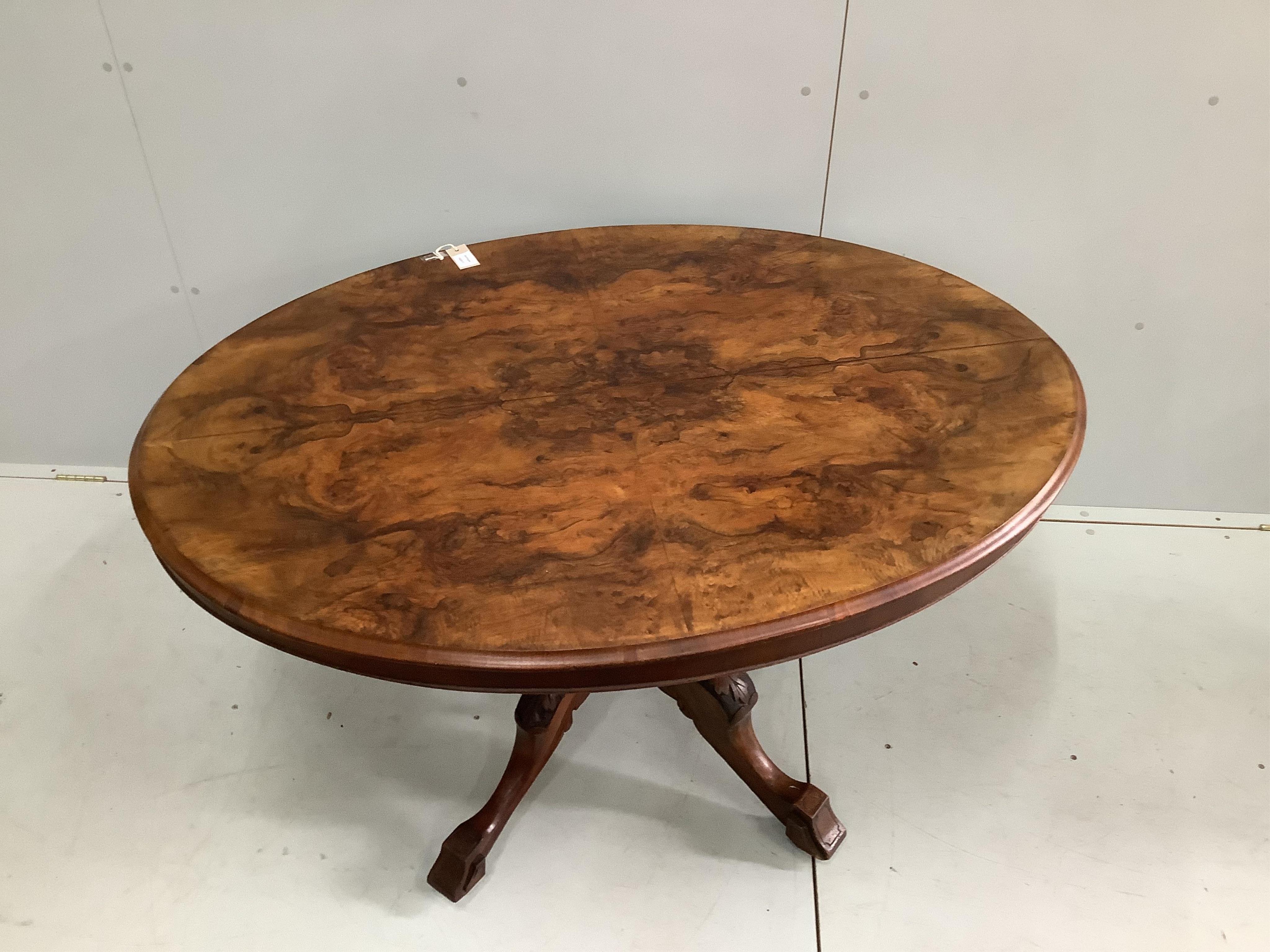 A Victorian figured walnut oval loo table, width 130cm, depth 100cm, height 70cm. Condition - fair